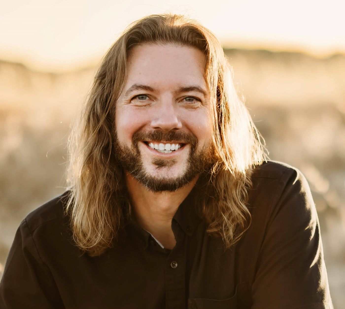 Portrait of Chris Chandler smiling outdoors